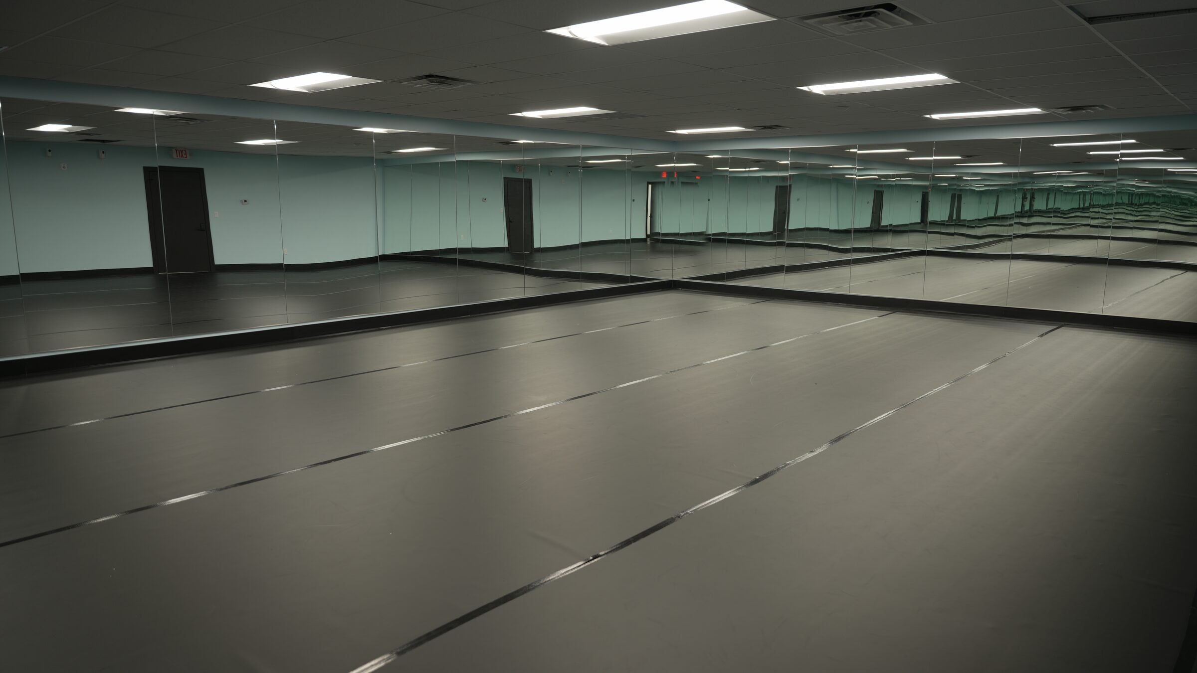 A large mirrored studio at Diamond Dance Complex with a sprung dance floor